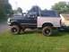 1994 Ford F-250 - This lifted 1994 Ford Bronco features a two-tone paint scheme and large off-road tires.