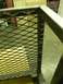 1990 Chevrolet Suburban - Close-up view of a metal grating section, likely part of a larger structure or vehicle component.