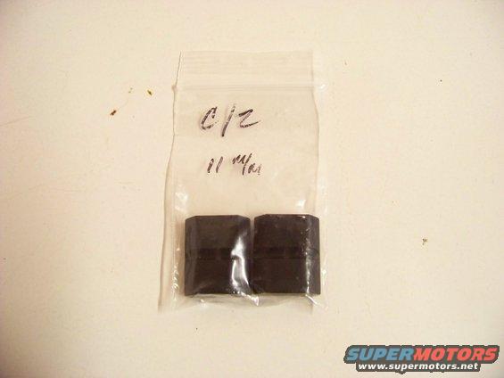 Two black rubber parts in a clear plastic bag with handwritten text 'C/2' and '11 1/4'