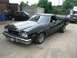 1973 Ford Ranchero - This 1973 Ford Ranchero is parked outside with another vehicle in the background.