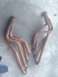 1964 Ford Ranchero - A pair of used exhaust manifolds are shown resting on a concrete floor.