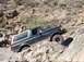 1993 Ford Bronco - This SUV is navigating a challenging rocky terrain.