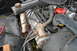 1978 Ford Bronco - Close-up view of engine components, including hoses and a red MSD distributor cap.