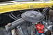 1978 Ford Bronco - Close-up view of a vehicle's engine bay, showing the air cleaner and distributor.
