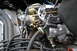 1978 Ford Bronco - The intricate details of a vehicle's engine, focusing on the carburetor and associated plumbing.