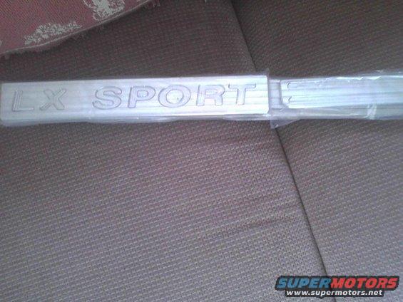 LX SPORT emblem on a car seat