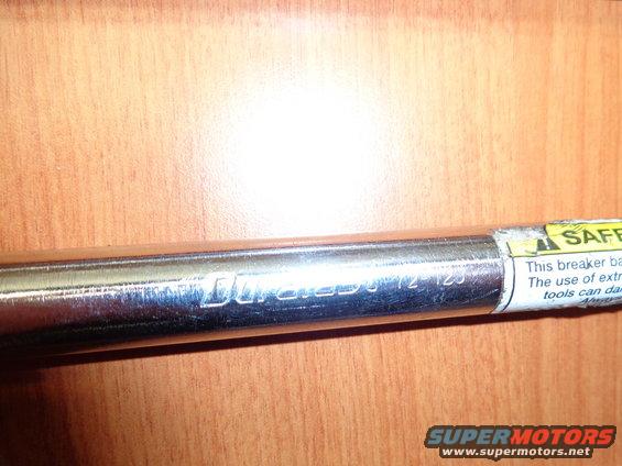 Chrome breaker bar with 'Duramax 1/2-125' and safety label