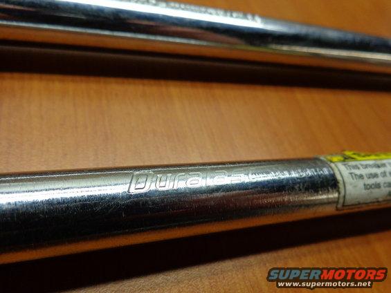 Two chrome tool shafts with 'Duralast' branding visible on the lower one