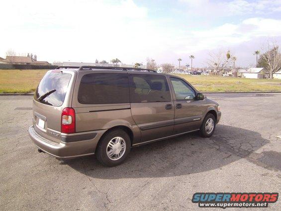 Tan 2005 Chevrolet Venture minivan, rear 3/4 view