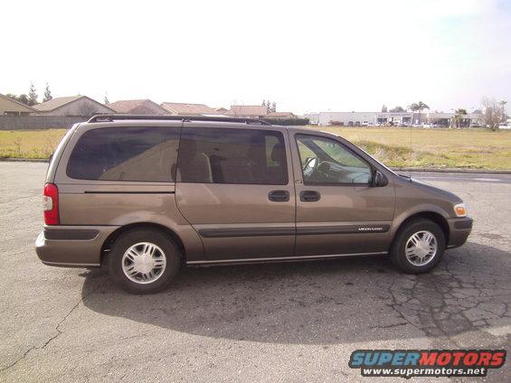 2005 Chevrolet Venture minivan, side view. Brown paint, roof rack, tinted windows