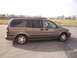 2005 Chevrolet Venture - Side view of a 2005 Chevrolet Venture minivan parked outdoors.