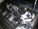 2005 Chevrolet Venture - The engine bay of a 2005 Chevrolet Venture is visible with the hood raised, revealing the engine and associated components.