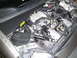 2005 Chevrolet Venture - The engine bay of a vehicle is shown with various mechanical and electrical parts.