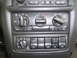 2005 Chevrolet Venture - The climate control panel features multiple knobs and buttons for adjusting various vehicle functions.
