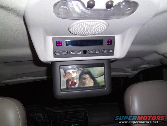 Overhead console with DVD player and screen showing cartoon character