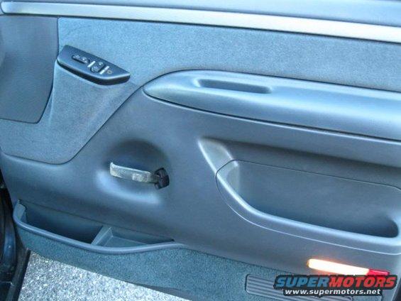 1994 Ford Bronco interior door panel with window controls and pull handle