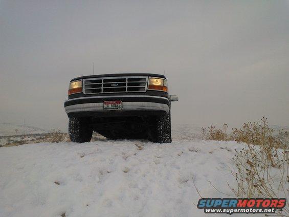 1992 Ford Bronco front view in snow, grille visible