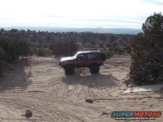 1986 Ford Bronco II on sandy trail with desert hills in background