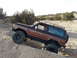 1986 Ford Bronco II - This 1986 Ford Bronco II is navigating a challenging sandy terrain, its off-road capabilities.