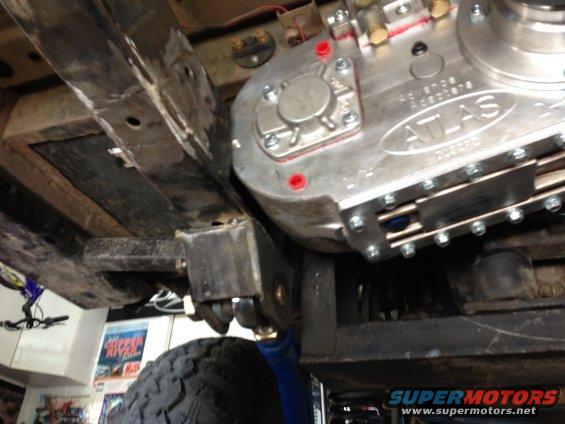 Advance Adapters Atlas transfer case mounted to vehicle frame with suspension components visible