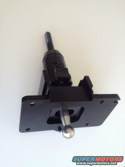 Black aftermarket shifter assembly with a silver ball shift knob against a white background