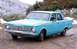 1970 Ford Ranchero - A light blue 1964 sedan is parked on a dirt road with snow-covered hills in the background.