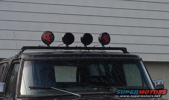 Roof rack with four KC lights, two with red logos