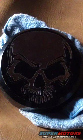 black skull emblem on a blue cloth