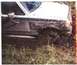 1988 Ford Bronco - This 1987 Ford Bronco is deeply stuck in mud, with its front wheel and fender partially submerged.