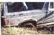 1988 Ford Bronco - This 1988 Ford Bronco is deeply stuck in the mud, with its rear wheel almost completely submerged in the mire.