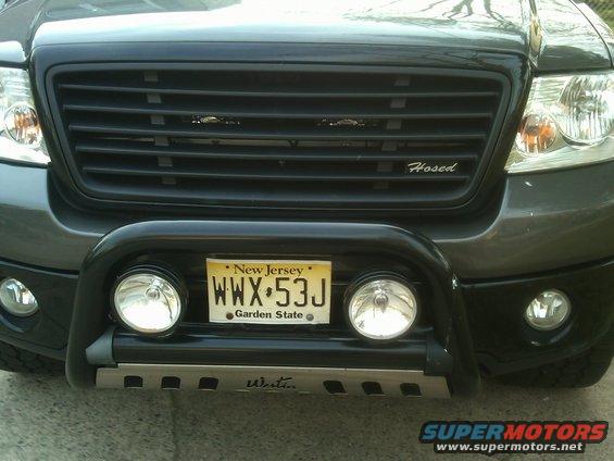2008 Ford F-150 front end with black grille, bull bar, and New Jersey license plate WWX-53J