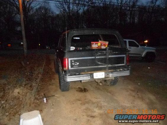 Rear view of a black 1986 Ford Bronco with a spare tire mount