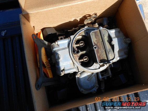 Carburetor in a cardboard box, close-up view