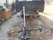 1986 Ford Bronco - The rear axle assembly has been removed from the truck and is resting on a floor jack.