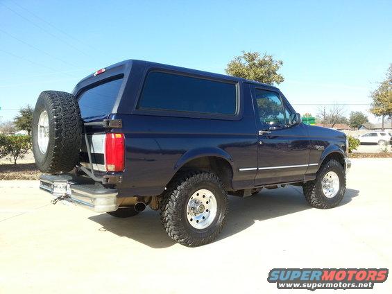 Dark blue 1995 Ford Bronco, rear view with spare tire