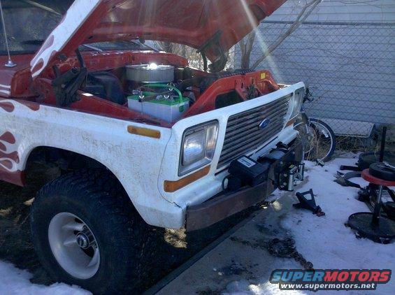 1979 Ford Bronco with hood open, showing engine and a winch mounted on the front bumper