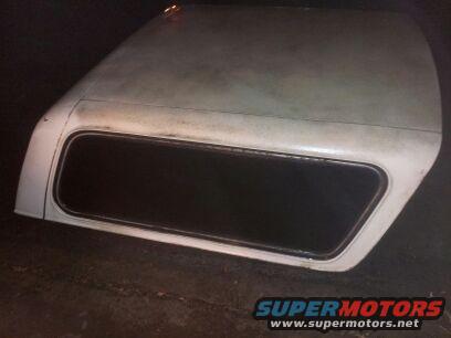 White truck bed cap with a dark tinted window