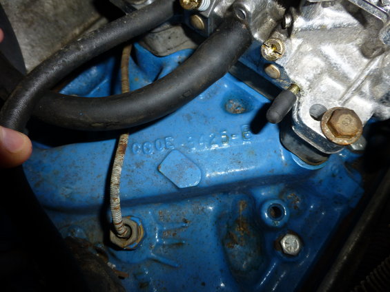 Blue engine block with stamped numbers 'CODE 4425-6'
