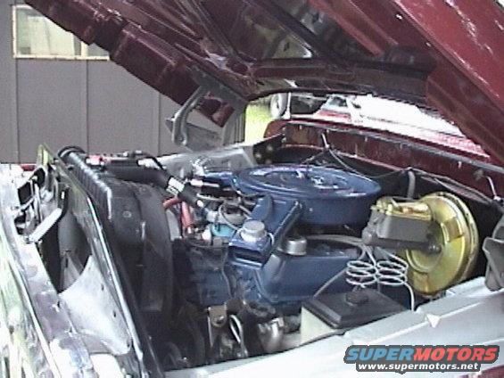 1979 Ford F-150 engine bay with blue air cleaner and gold brake booster