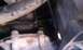 1995 Ford Bronco - Green fluid is leaking from the engine compartment, indicating a potential coolant issue.