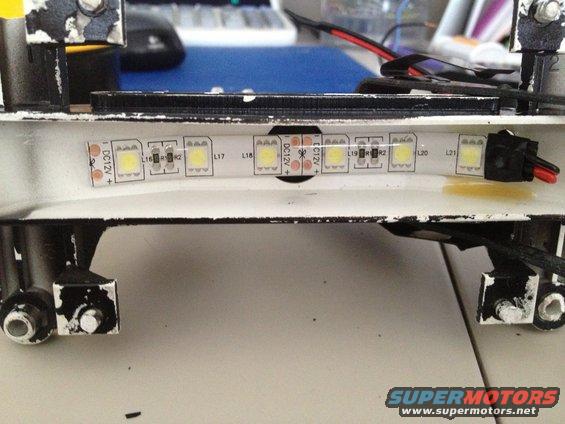LED strip lights with DC12V markings on white bracket