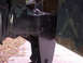 1994 Ford Bronco - Close-up view of vehicle frame and suspension components, showing signs of rust and black paint.