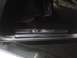 2003 Ford Crown Victoria - Close-up of a chrome LX SPORT door sill plate inside a vehicle.