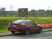 2003 Mercury Marauder - A red Ford Mustang is parked by the side of the road with a "Scotland welcomes you" sign in the background.