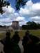 1960 Ford Falcon - Tourists gather at the base of a pyramid at Chichen Itza, Mexico, under a dramatic sky.