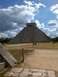 1960 Ford Falcon - The ancient Mayan pyramid of Kukulcan at Chichen Itza stands under a partly cloudy sky.