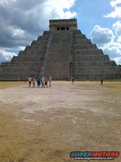 El Castillo pyramid at Chichen Itza with tourists in the foreground
