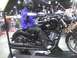 2003 Ford Crown Victoria - A mannequin dressed in riding gear sits on a black motorcycle on display.
