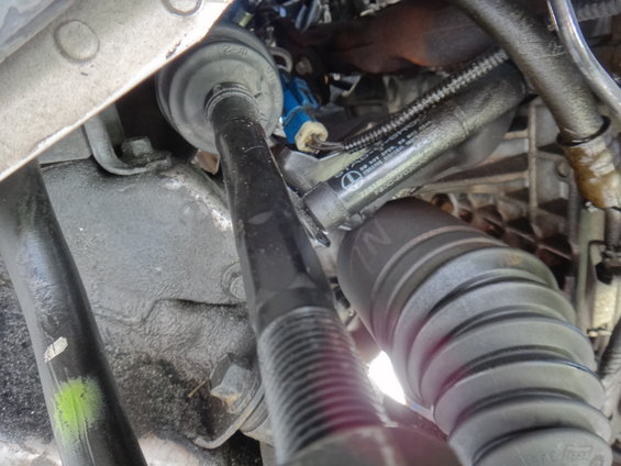 close-up of car's steering linkage and boot