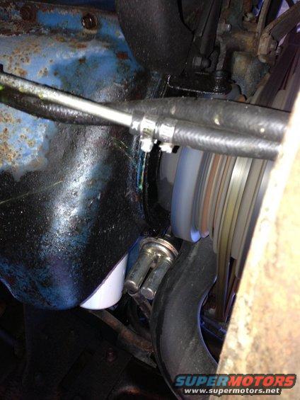 Engine oil filter and hoses with visible fluid leaks